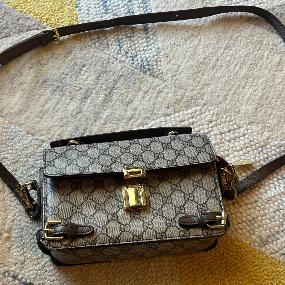 Gucci Beige and Brown Crossbody Bag it’s a copy..